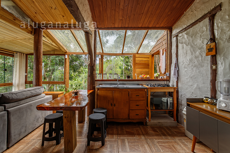 Casa de Vidro com Vista Deslumbrante